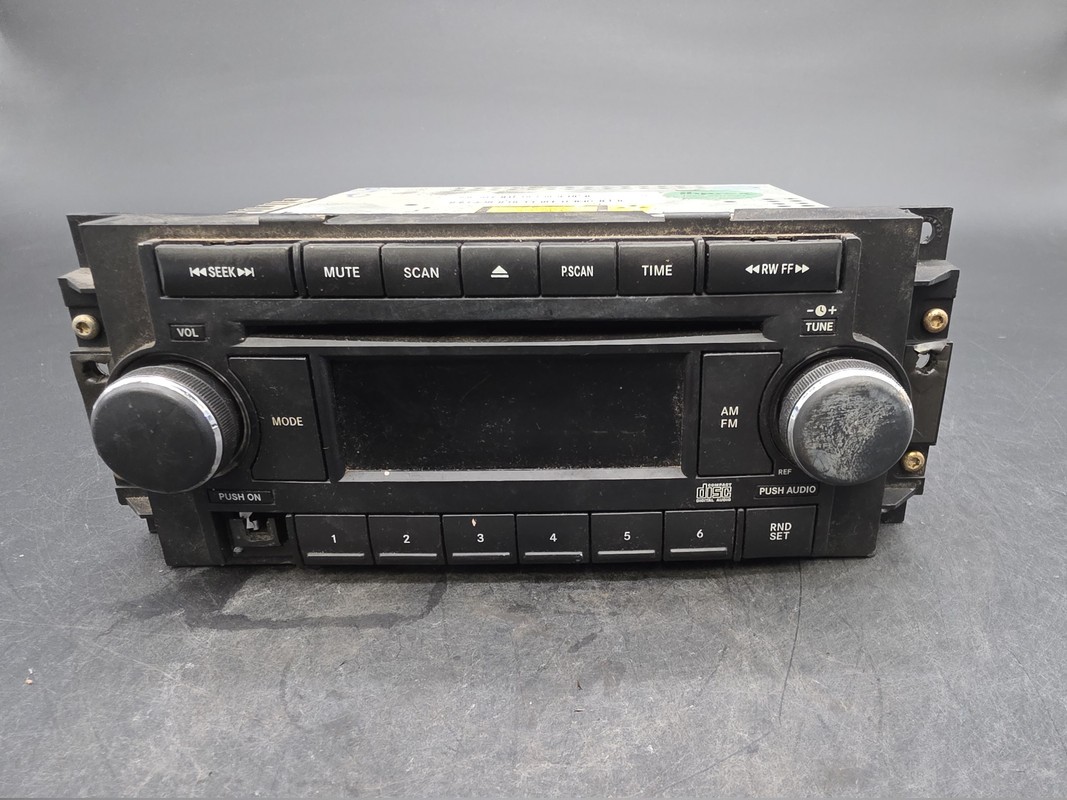 OEM 04-10 Chrysler Dodge Jeep Radio CD AUX Input 05064171AF Used