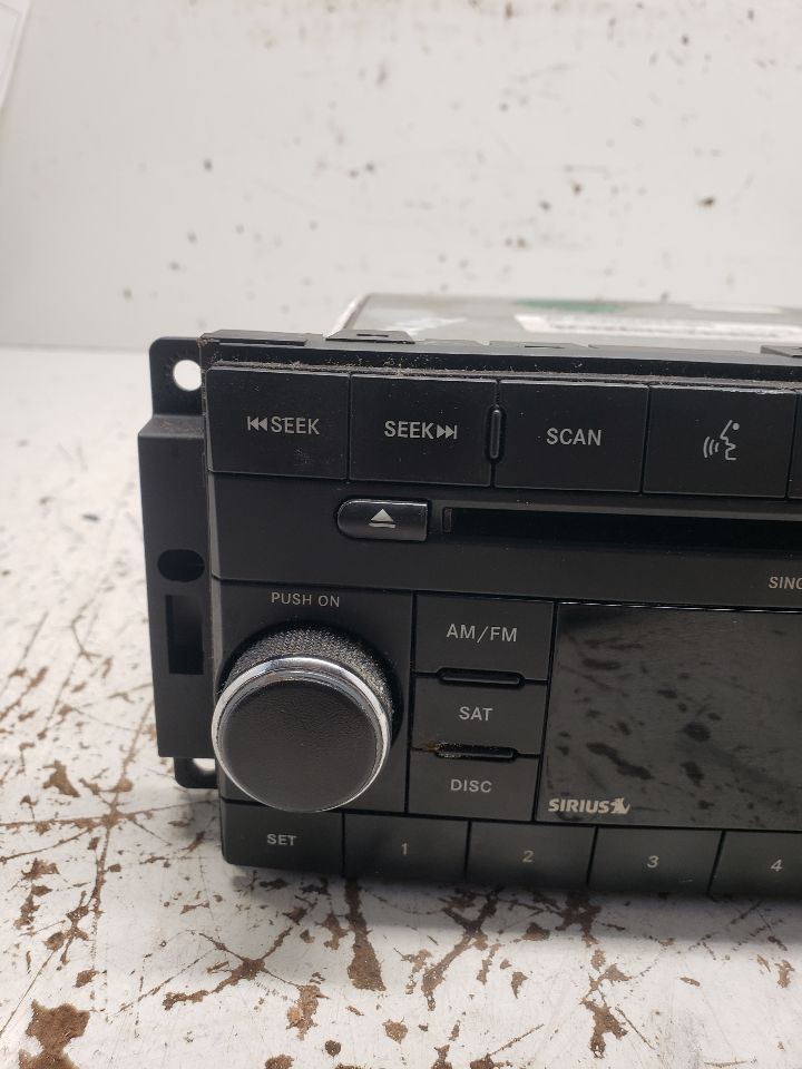 2008-2010 Dodge Dakota Radio AM FM CD-MP3 Face Plate ID RES OEM 1370854