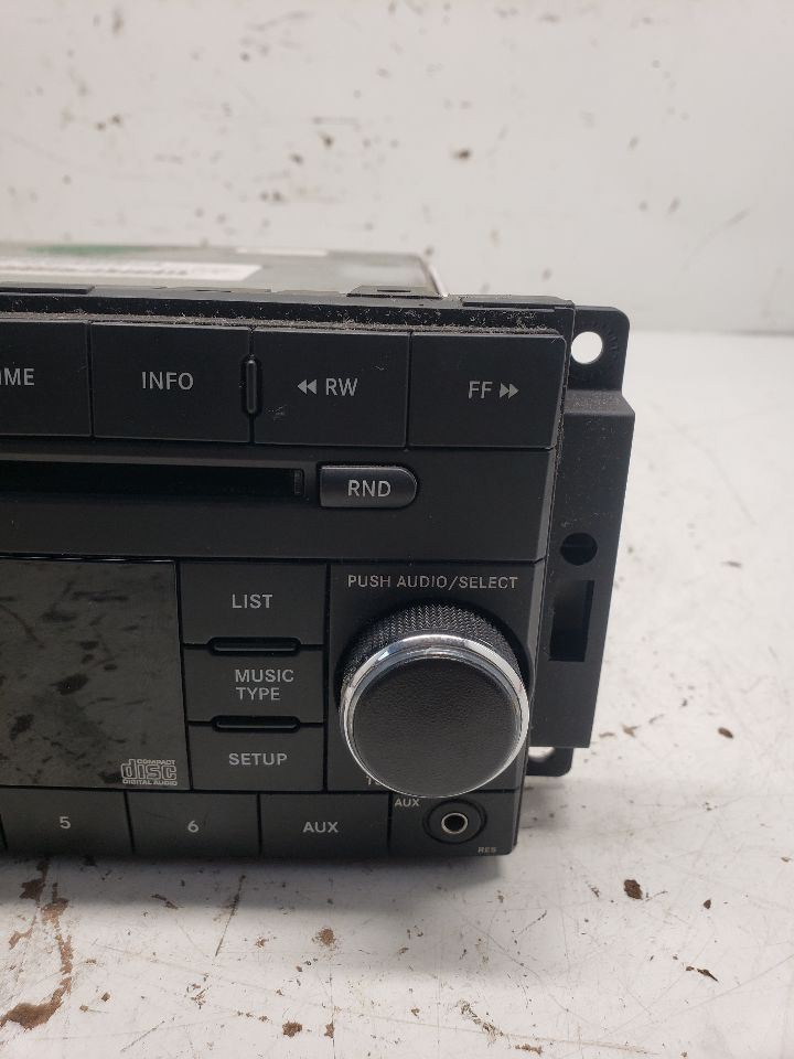 2008-2010 Dodge Dakota Radio AM FM CD-MP3 Face Plate ID RES OEM 1370854