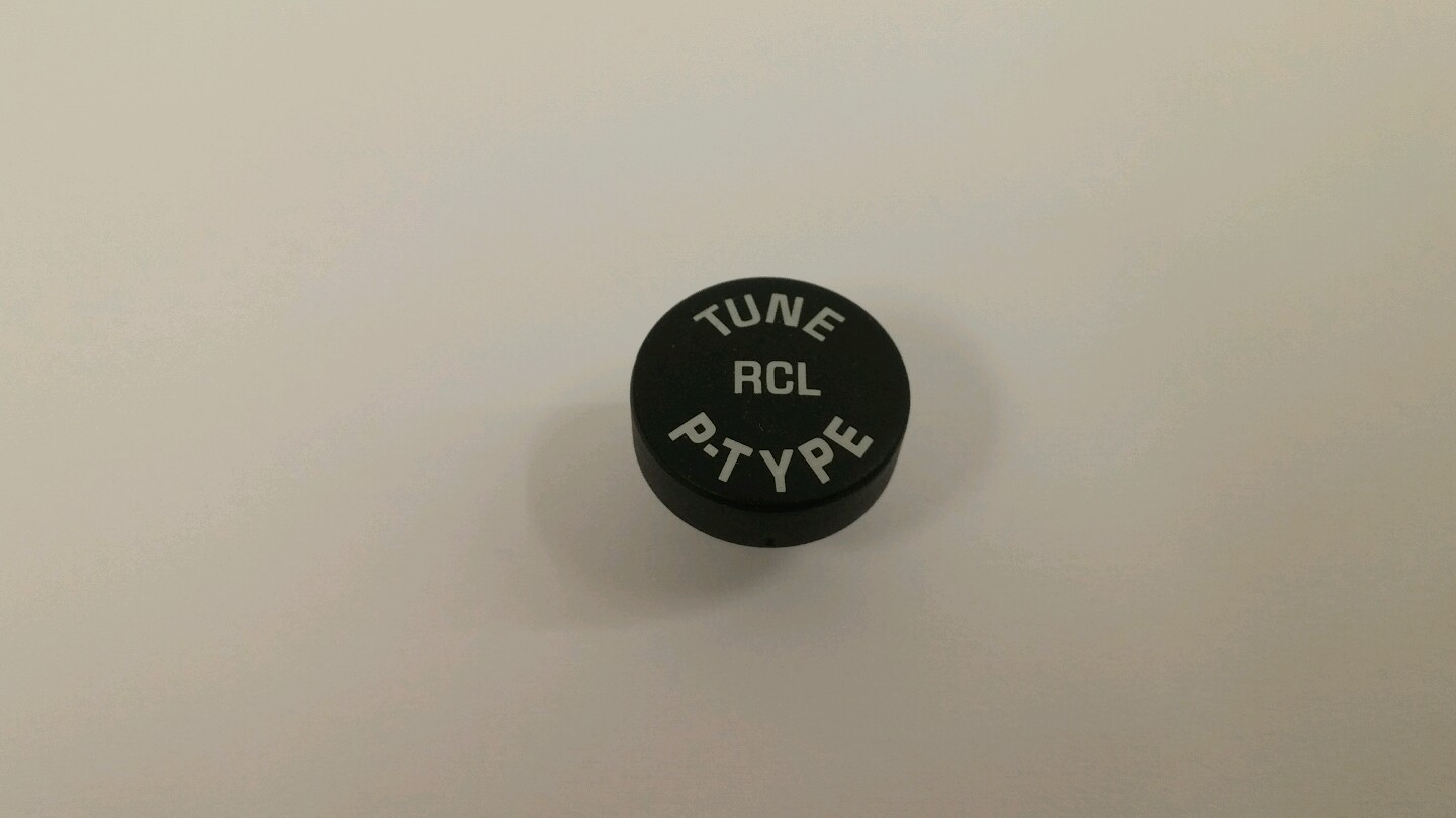 Oldsmobile radio TUNE RCL P-TYPE button. New Old Stock CD stereo part. White