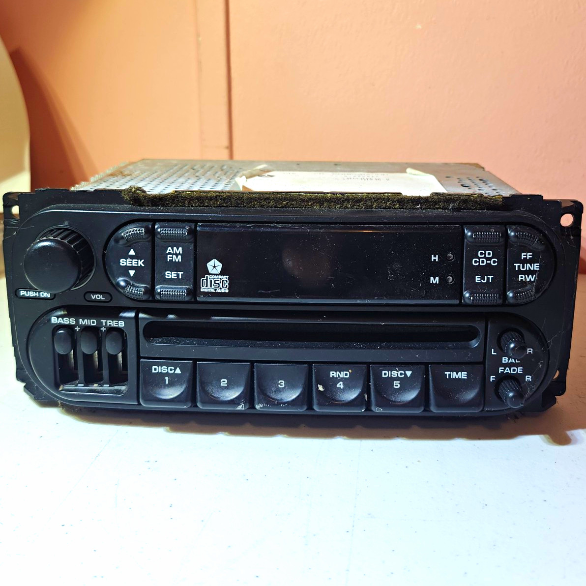OEM Daimler Chrysler car radio with a CD player, specifically a model