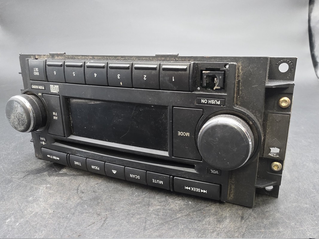 OEM 04-10 Chrysler Dodge Jeep Radio CD AUX Input 05064171AF Used